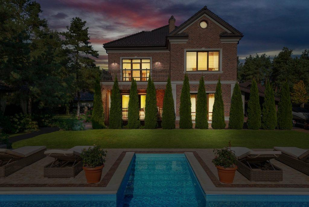 Home with a completed front yard landscape installation